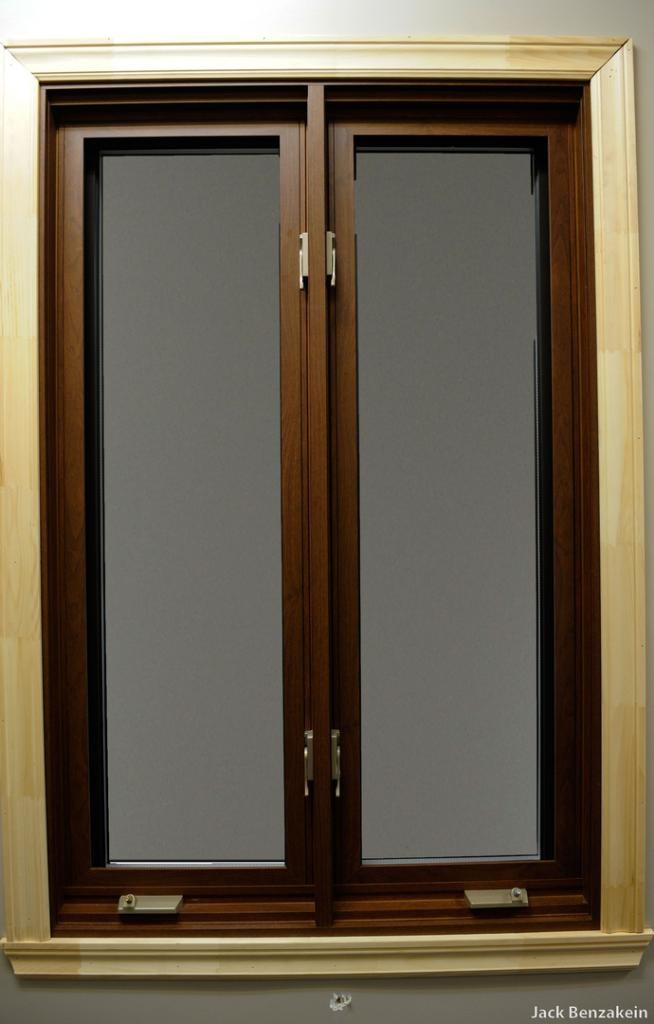 Double dark wood casement window with grey glass