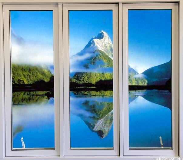 Triple casement window mountain lake reflection